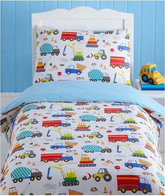 A children's bedding set with a construction vehicle theme, laid out on a bed with a blue striped duvet cover.