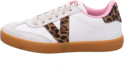 A side view of a white sneaker with leopard print accents.