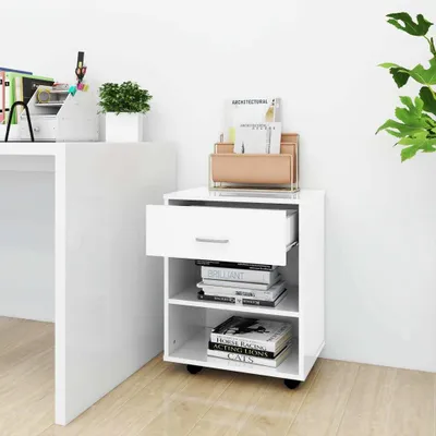 A white cabinet with a drawer and shelves, next to a desk.