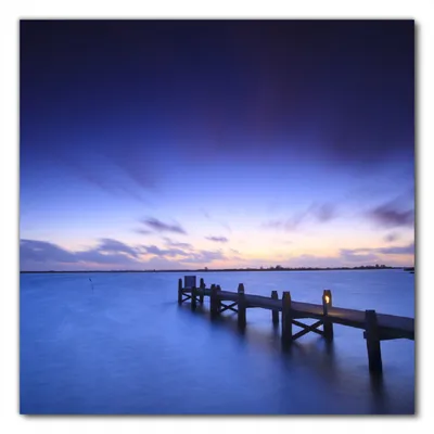 Produktbild von Wallario selbstklebende Möbelfolie/ Tischdecke für Innen und Außen, Größe: 50 x 50 cm - Steg bei Abenddämmerung - Blauer Himmel bei Nacht