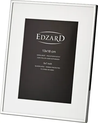 A silver-colored picture frame with a black insert and text on the insert.