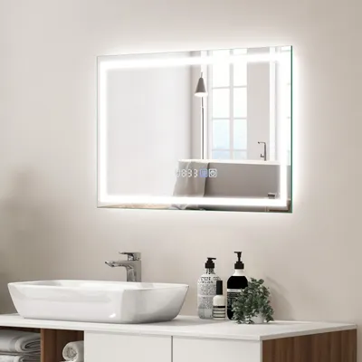 A modern bathroom vanity with a sink and a lighted mirror.