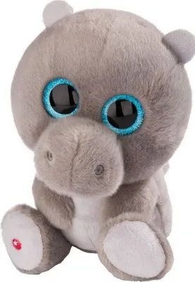 A plush toy hippo with large blue eyes sits facing the camera.