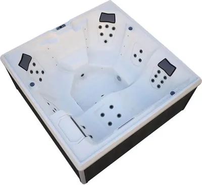 A top-down, slightly angled view of a white and black outdoor whirlpool spa.