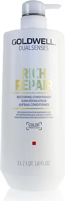 A white pump bottle of Goldwell Dualsenses Rich Repair Restoring Conditioner against a white background.
