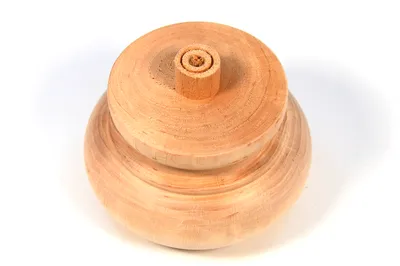 A wooden furniture leg with a layered, rounded design and a central cylindrical protrusion on top.