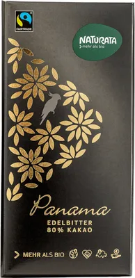 A close-up of a chocolate bar wrapper with decorative floral patterns and text.