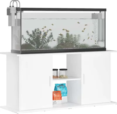 A white aquarium stand with an aquarium on top, containing fish and plants.
