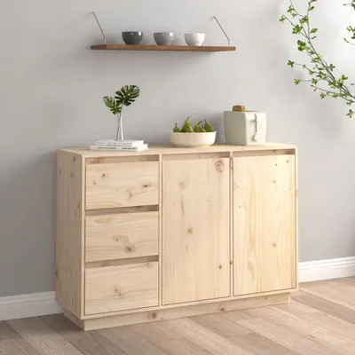 A wooden sideboard with drawers and doors, decorated with a vase of leaves, a bowl of pears, and a toaster.