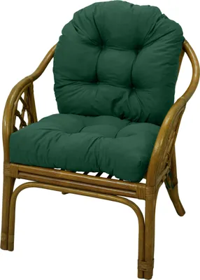 A green cushion on a rattan chair.
