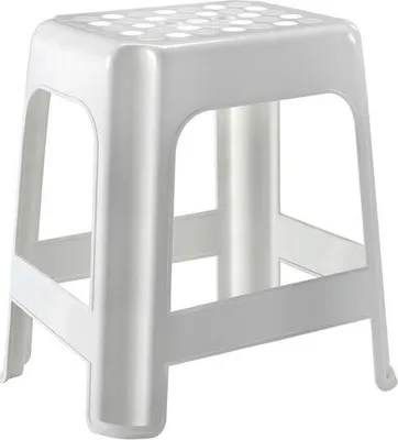 A white plastic stool with a textured top.