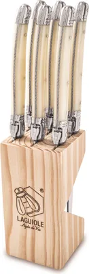 A set of six Laguiole steak knives in a wooden block.