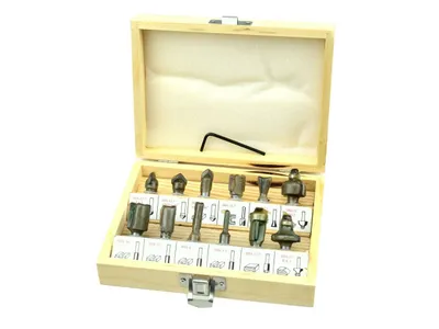 A set of router bits in a wooden box.