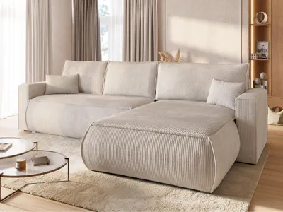 A modern living room with a large sectional sofa and coffee tables.