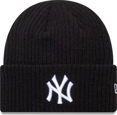 A black New Era beanie with a white New York Yankees logo.