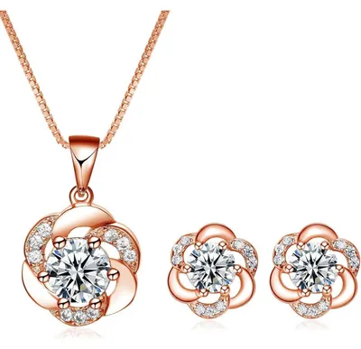 Immagine prodotto di Set di gioielli da donna in argento 925: collana e orecchini a forma di fiori con zirconi, placcati in oro rosa, confezionati in una scatola regalo