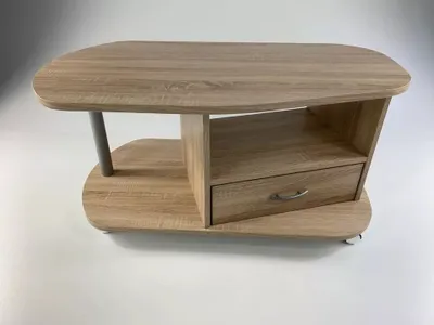 A modern coffee table with a drawer and shelf, made of Sonoma oak.