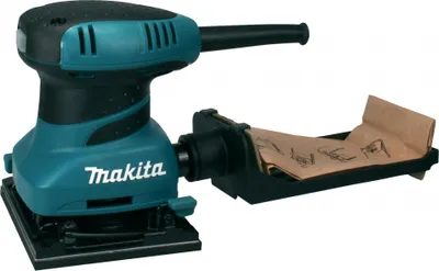 A Makita orbital sander with a dust collection bag.