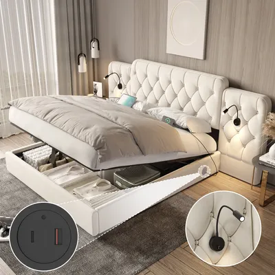 A bedroom scene featuring a large, tufted beige bed with its storage compartment open, revealing stored items. Two inset circular images highlight a USB/power outlet and a reading lamp.