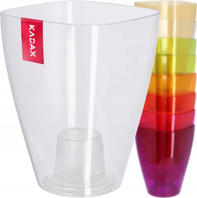 A transparent planter pot with a stack of colored planter pots in the background.