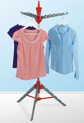 A compact laundry rack with clothes hanging on it.