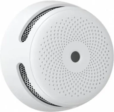 A white smoke detector is shown from a slightly elevated side angle against a white background.