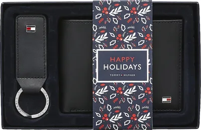 A gift set containing a wallet and keychain, presented in a box with holiday-themed packaging.