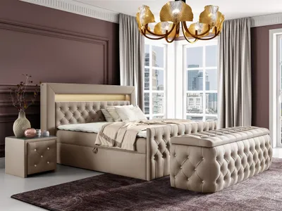 A bedroom scene featuring a bed, nightstand, and storage bench.