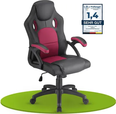 A gaming chair is shown on a green circular mat against a white background. A certification badge is visible in the upper right corner.