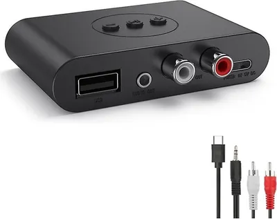 A black Bluetooth audio receiver with various ports and included cables.