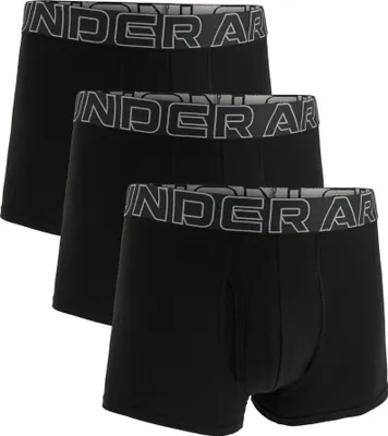 Three black boxer shorts are arranged in a staggered formation against a white background.