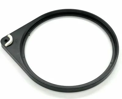 A black ring with a white clip on a white background.