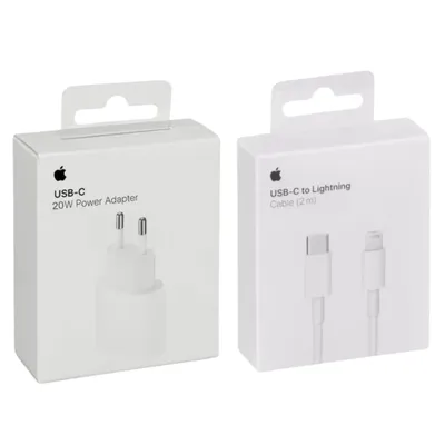 Two white product boxes are shown side-by-side against a white background. The box on the left displays an image of a white power adapter and text indicating it is a USB-C 20W Power Adapter. The box on the right shows an image of a white USB-C to Lightning