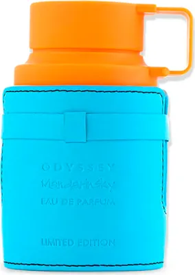 A close-up shot of a perfume bottle with an orange cap and a blue leather-like casing.