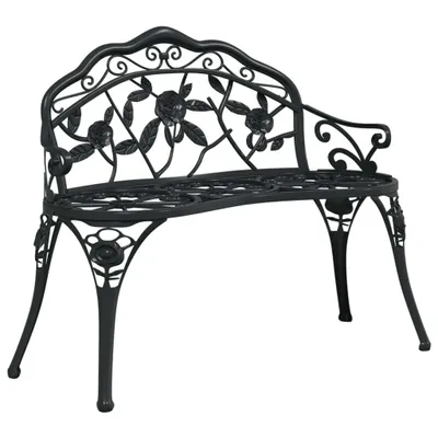 A black metal garden bench with ornate rose detailing.