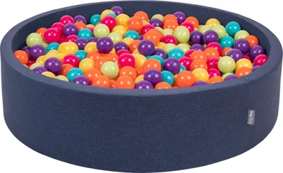 A dark blue ball pit filled with colorful plastic balls.