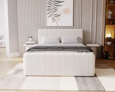 A modern bedroom with a beige upholstered bed and minimalist decor.