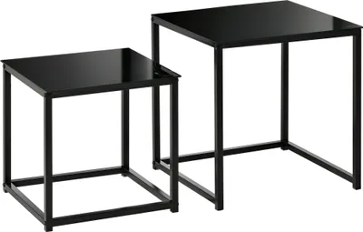 Two black nesting tables with square glass tops and black metal frames are shown against a white background.
