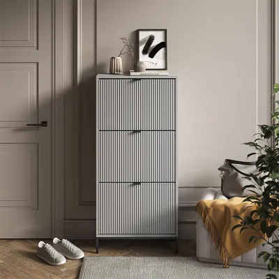 A hallway or entryway scene with a shoe cabinet, door, and seating.