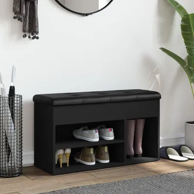 A black shoe bench with storage compartments in a hallway setting.