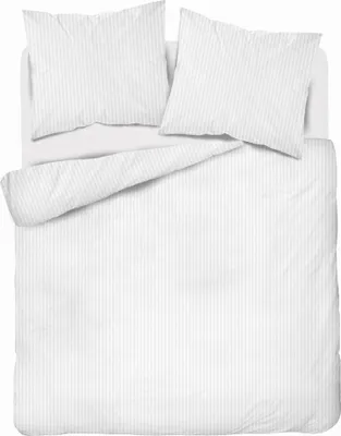 A neatly made bed with white striped bedding and two pillows.