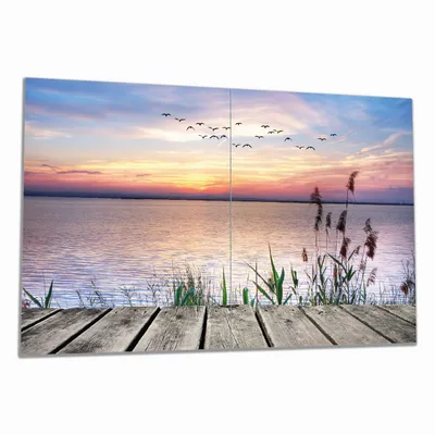 Produktbild von Wallario Herdabdeckplatte aus Glas, Größe 80 x 52 cm 2-teilig, Motiv Seepanorama mit Schilf und fliegenden Vögeln