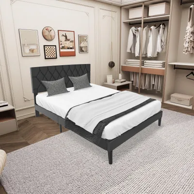 A bedroom with a bed, closet, and wall art.