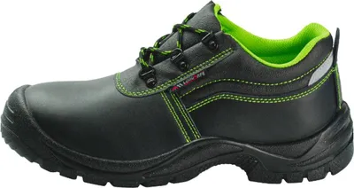 A side view of a black safety shoe with green accents.