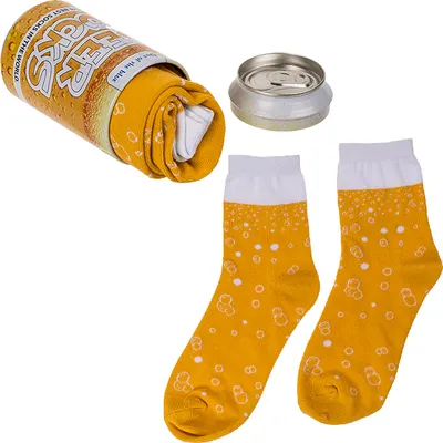 A pair of socks designed to look like a beer can, with the socks themselves patterned to resemble beer with foam and bubbles. The socks are shown next to their packaging, which is a metal can designed to look like a beer can.