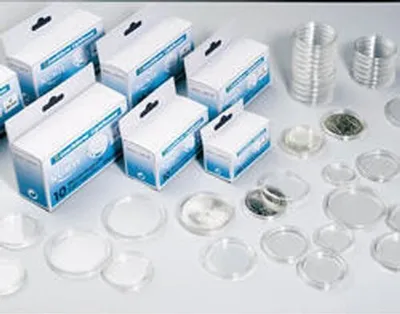 A collection of coin capsules and their packaging.