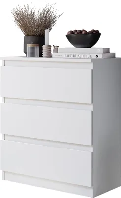 A white three-drawer dresser with decorative items on top.