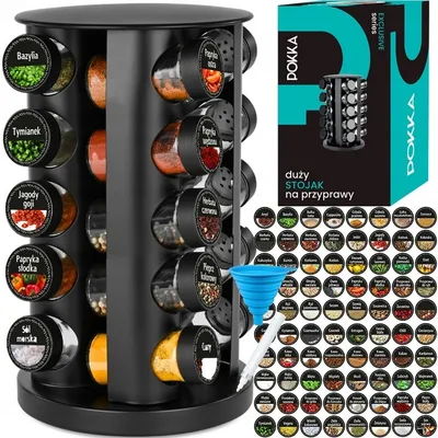 A black rotating spice rack with 20 glass jars filled with spices, displayed with a blue funnel and a box of stickers. The background is white.