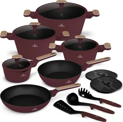 A set of cookware and kitchen utensils arranged on a white background.