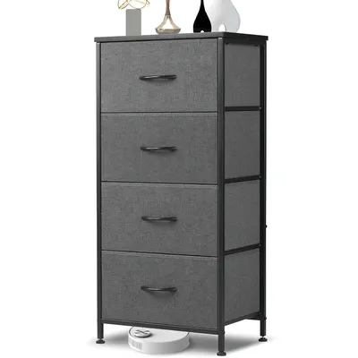 A grey fabric dresser with a black metal frame is shown against a white background. Decorative items are on top of the dresser, and a white robot vacuum cleaner is on the floor beneath it.